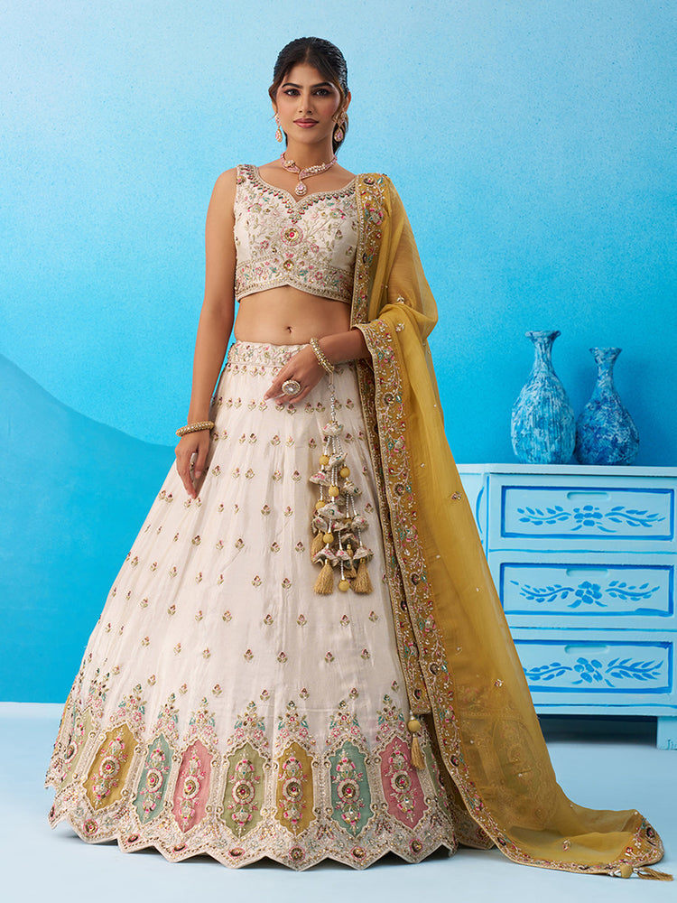cream and mustard tissue sequined embroidered semi stitched lehenga set