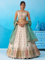 cream and sky heavy embroidered tissue lehenga