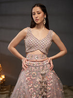elegant mauve bridal lehenga with embroidered net fabric