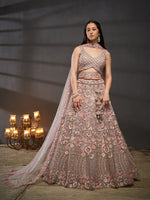 elegant mauve bridal lehenga with embroidered net fabric