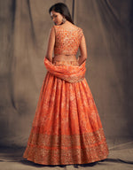 orange embroidered organza lehenga for reception wear
